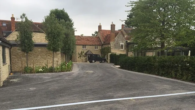 A driveway leading to a domestic home